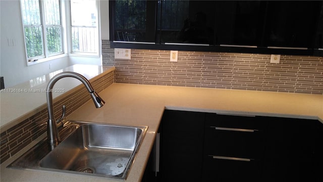 kitchen featuring sink and backsplash