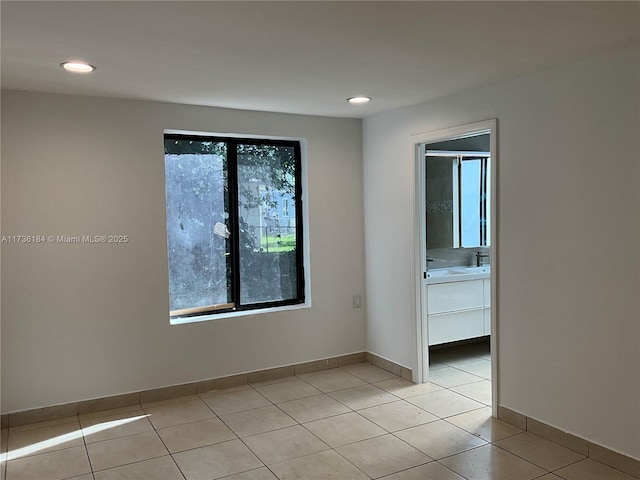 empty room featuring light tile patterned floors