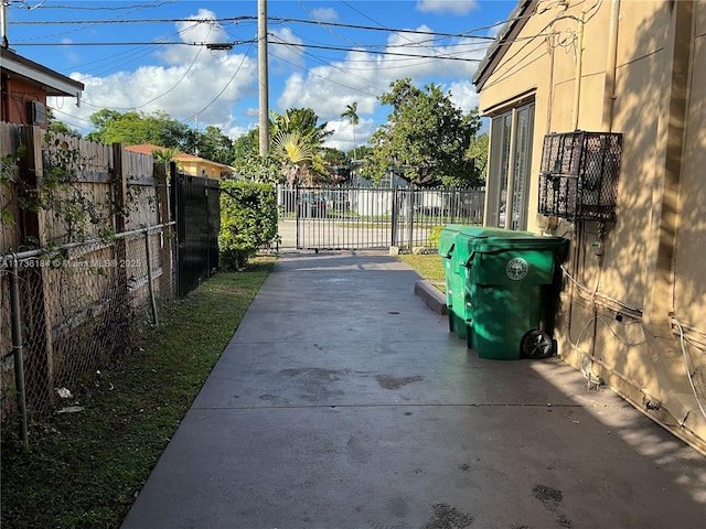 view of gate with a patio area