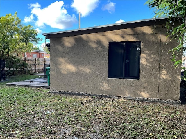 view of side of property with a patio