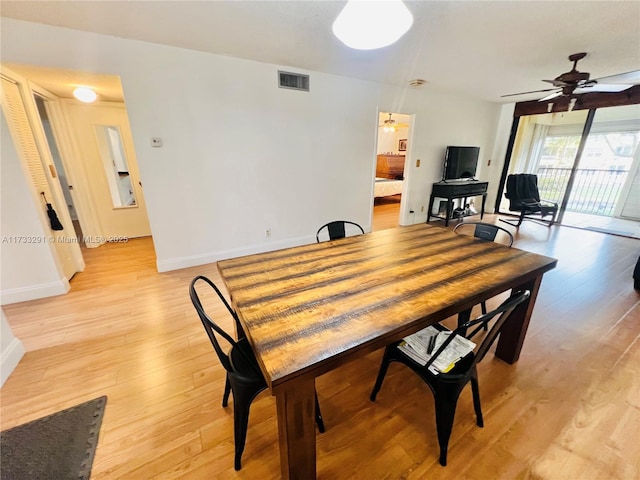 dining area featuring ceiling fan and light hardwood / wood-style flooring