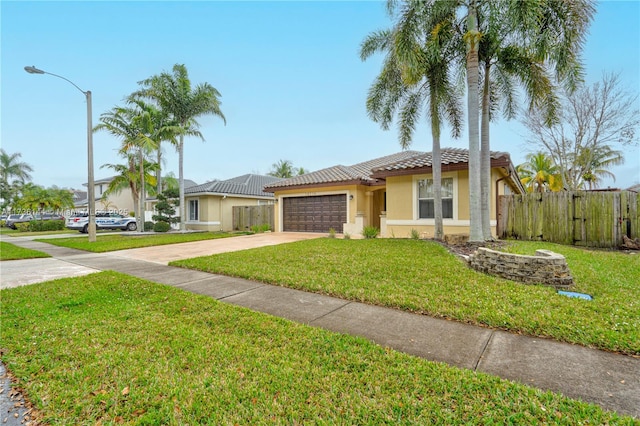 view of front facade with a garage and a front yard