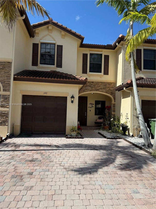 mediterranean / spanish house with a garage