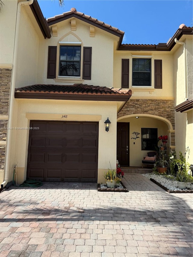 mediterranean / spanish house featuring a garage