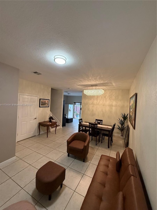 tiled living room with a textured ceiling