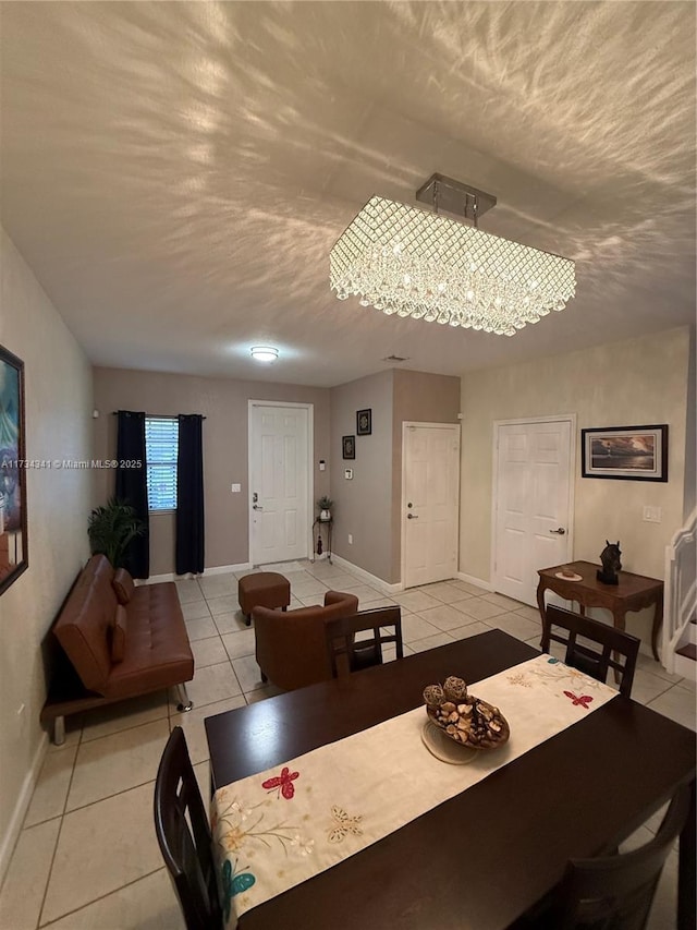 tiled dining room with a textured ceiling