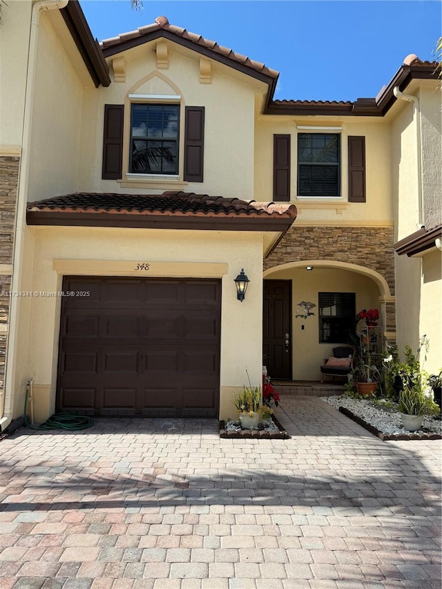 mediterranean / spanish-style house featuring a garage