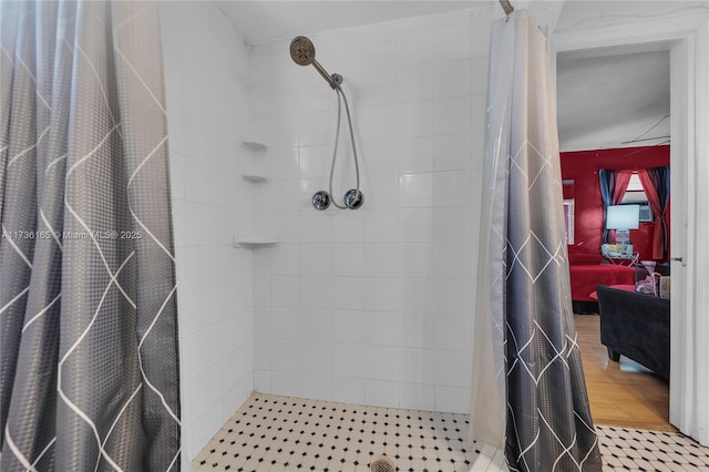 bathroom featuring hardwood / wood-style floors and a shower with curtain