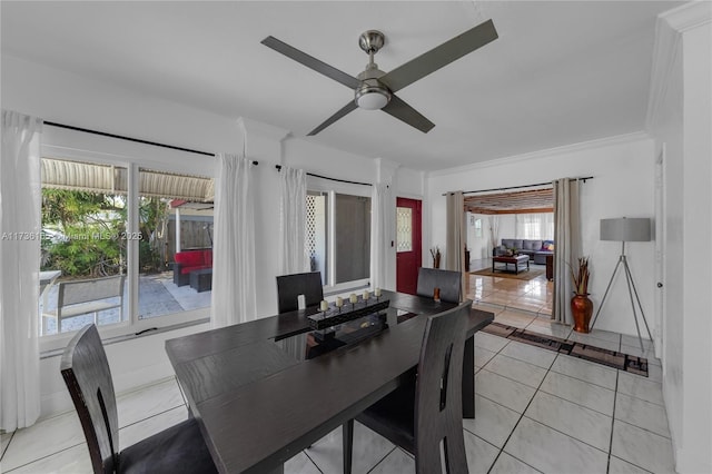 dining space with light tile patterned floors and ceiling fan