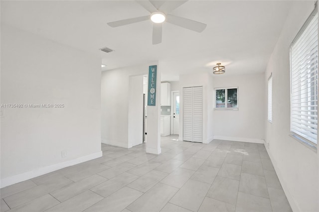 spare room featuring ceiling fan