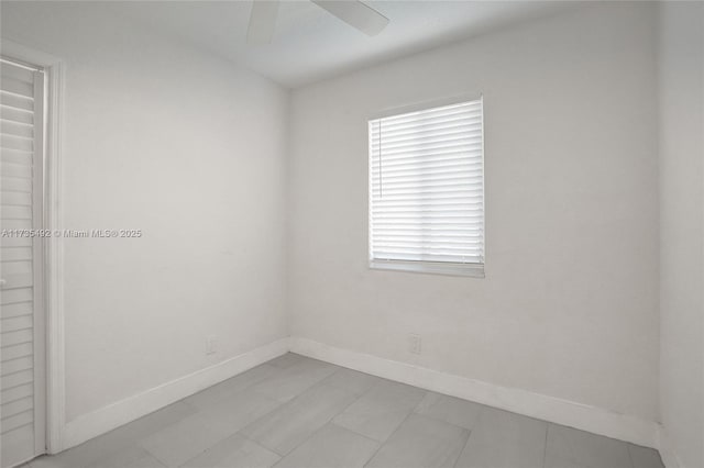 spare room with ceiling fan