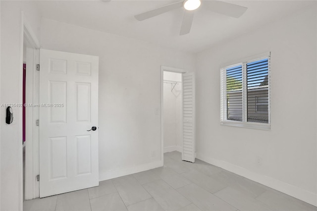 unfurnished bedroom featuring a closet and ceiling fan