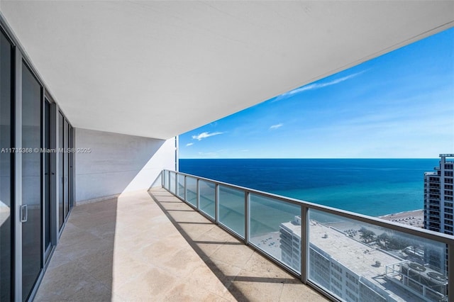 balcony with a water view and central AC unit