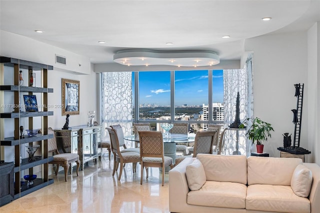 living room featuring a wall of windows