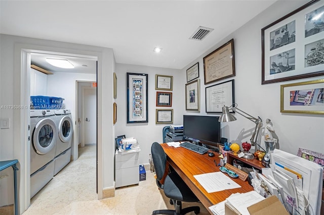 office area featuring washing machine and clothes dryer