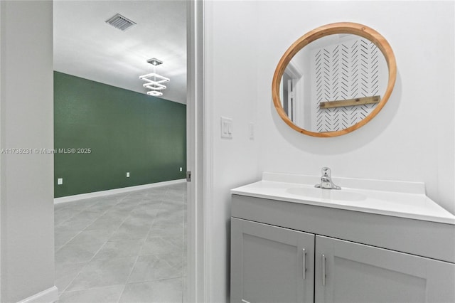 bathroom with tile patterned floors and vanity