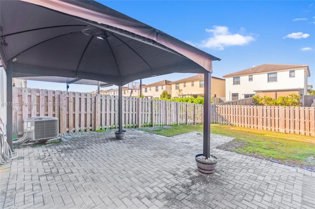 view of patio featuring a gazebo and cooling unit