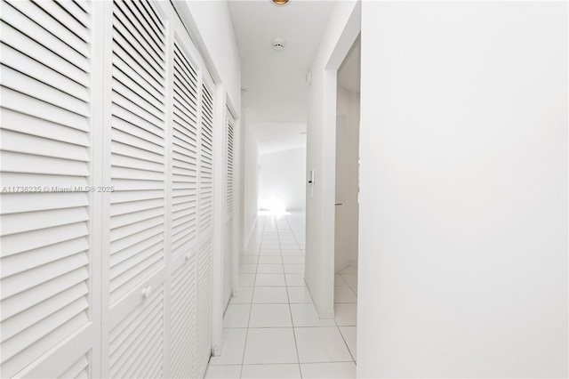 hallway with light tile patterned floors