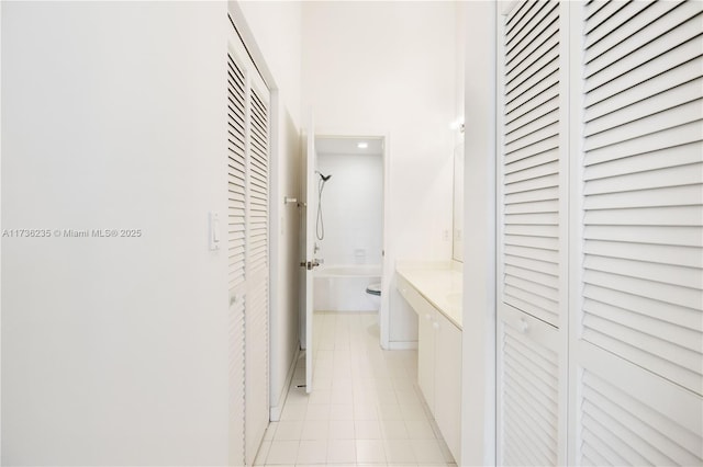 hallway with light tile patterned flooring