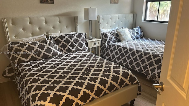 bedroom with wood-type flooring