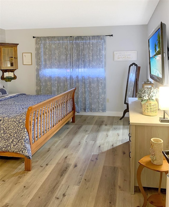 bedroom featuring light wood-type flooring