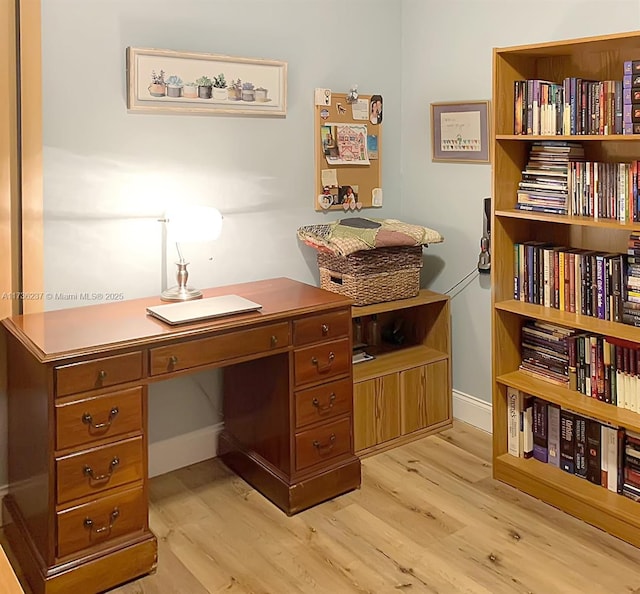 office space with light hardwood / wood-style flooring