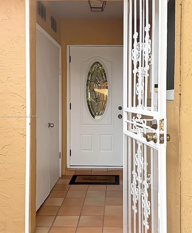 doorway to property featuring visible vents