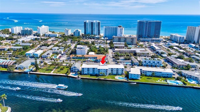 drone / aerial view with a view of city and a water view