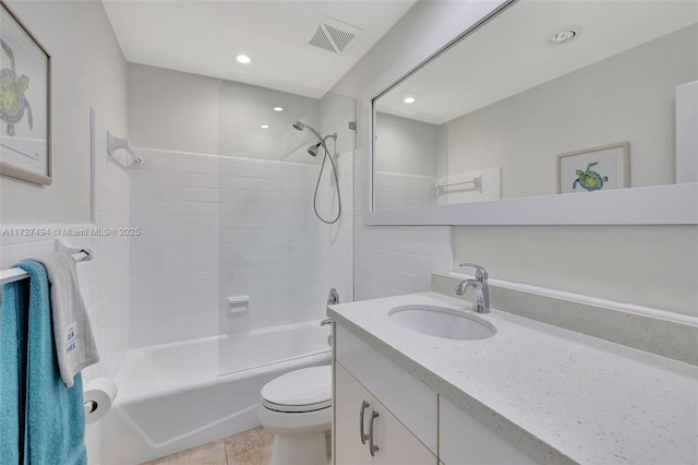 bathroom featuring bathtub / shower combination, visible vents, toilet, vanity, and tile patterned floors