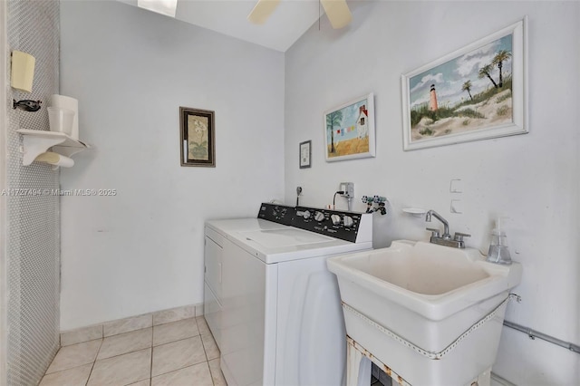 laundry room with light tile patterned floors, laundry area, a sink, a ceiling fan, and washing machine and clothes dryer