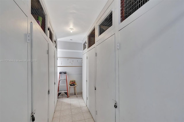 hall with light tile patterned floors and visible vents