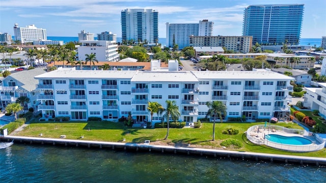 aerial view featuring a water view and a city view