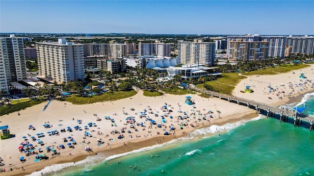 aerial view with a water view, a city view, and a view of the beach