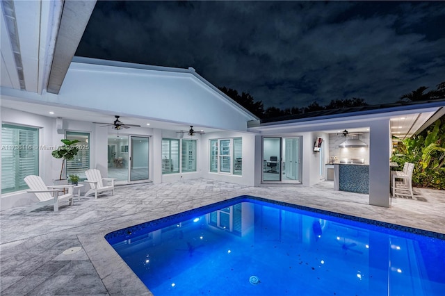 16141 W Troon Cir, Miami Lakes, FL 33014 - pool at twilight with ceiling fan, exterior bar, a patio area, and an outdoor pool