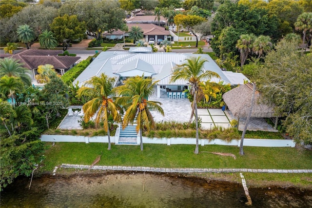 birds eye view of property with a water view