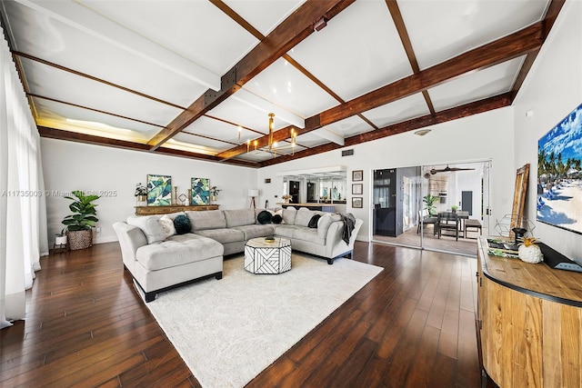 living room featuring dark wood-type flooring and beam ceiling