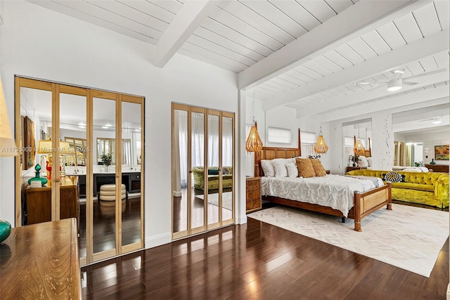 bedroom with dark hardwood / wood-style flooring, wooden ceiling, and beamed ceiling