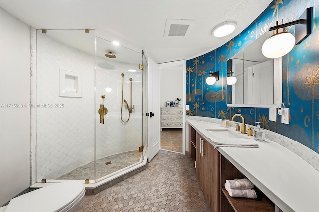 bathroom with vanity, toilet, tile patterned floors, and walk in shower