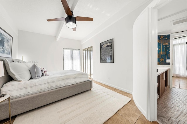 bedroom featuring multiple windows, light tile patterned flooring, ceiling fan, and beamed ceiling