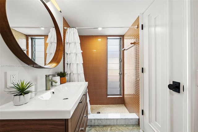 bathroom with vanity and walk in shower