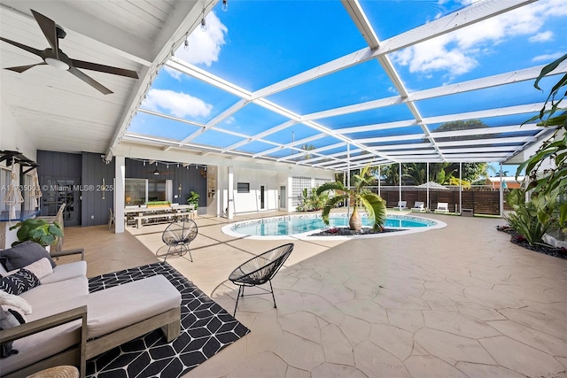 view of swimming pool with a lanai, outdoor lounge area, a patio, and ceiling fan