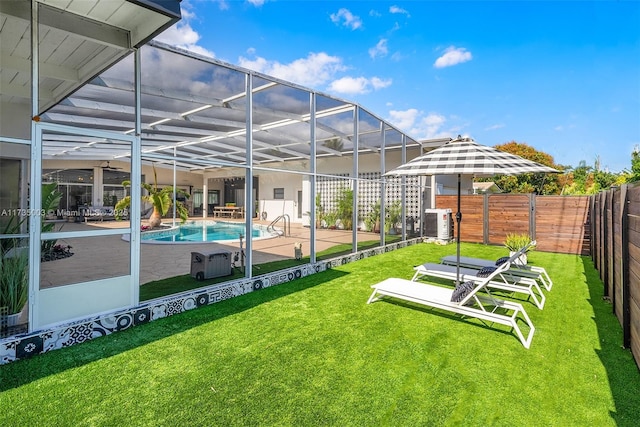 exterior space with a fenced in pool, a patio, and glass enclosure