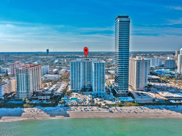 city view featuring a water view and a beach view