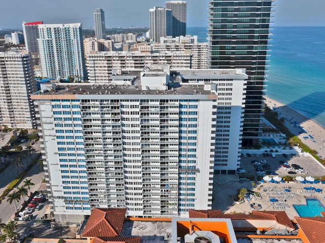 exterior space with a water view and a view of the beach