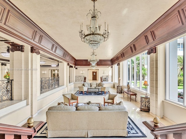 sunroom featuring an inviting chandelier