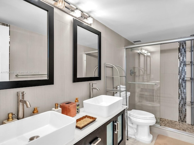 bathroom featuring walk in shower, vanity, and toilet