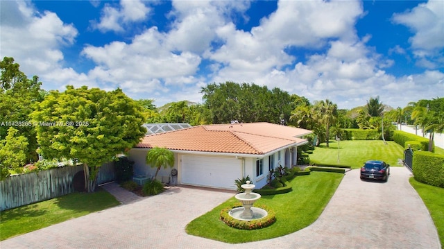 view of front of property featuring a garage and a front lawn