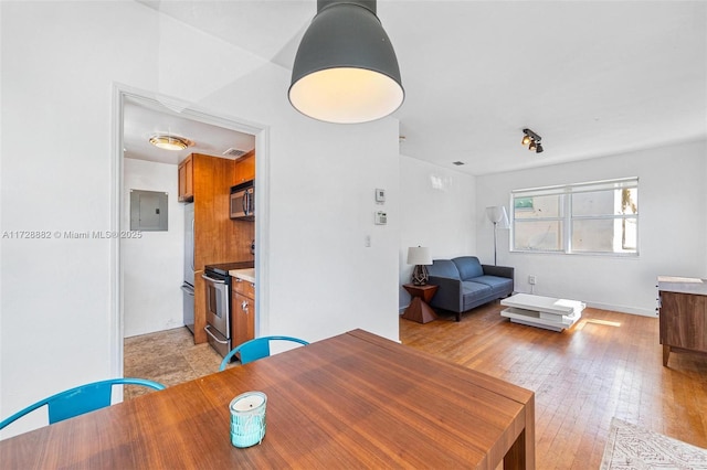 dining space with light wood-type flooring