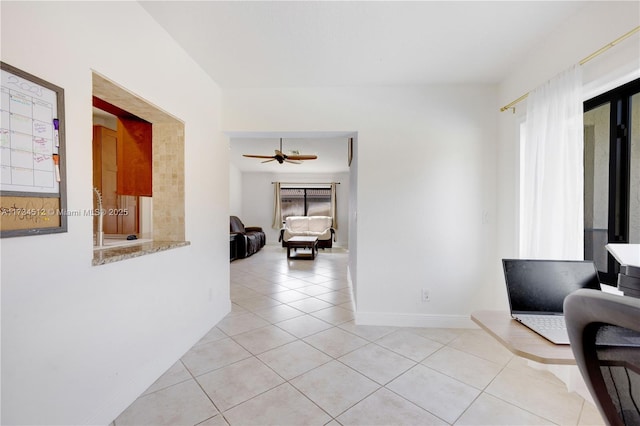 hall featuring light tile patterned floors