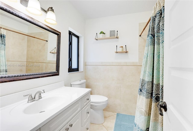 bathroom with toilet, a shower with curtain, tile walls, vanity, and tile patterned flooring